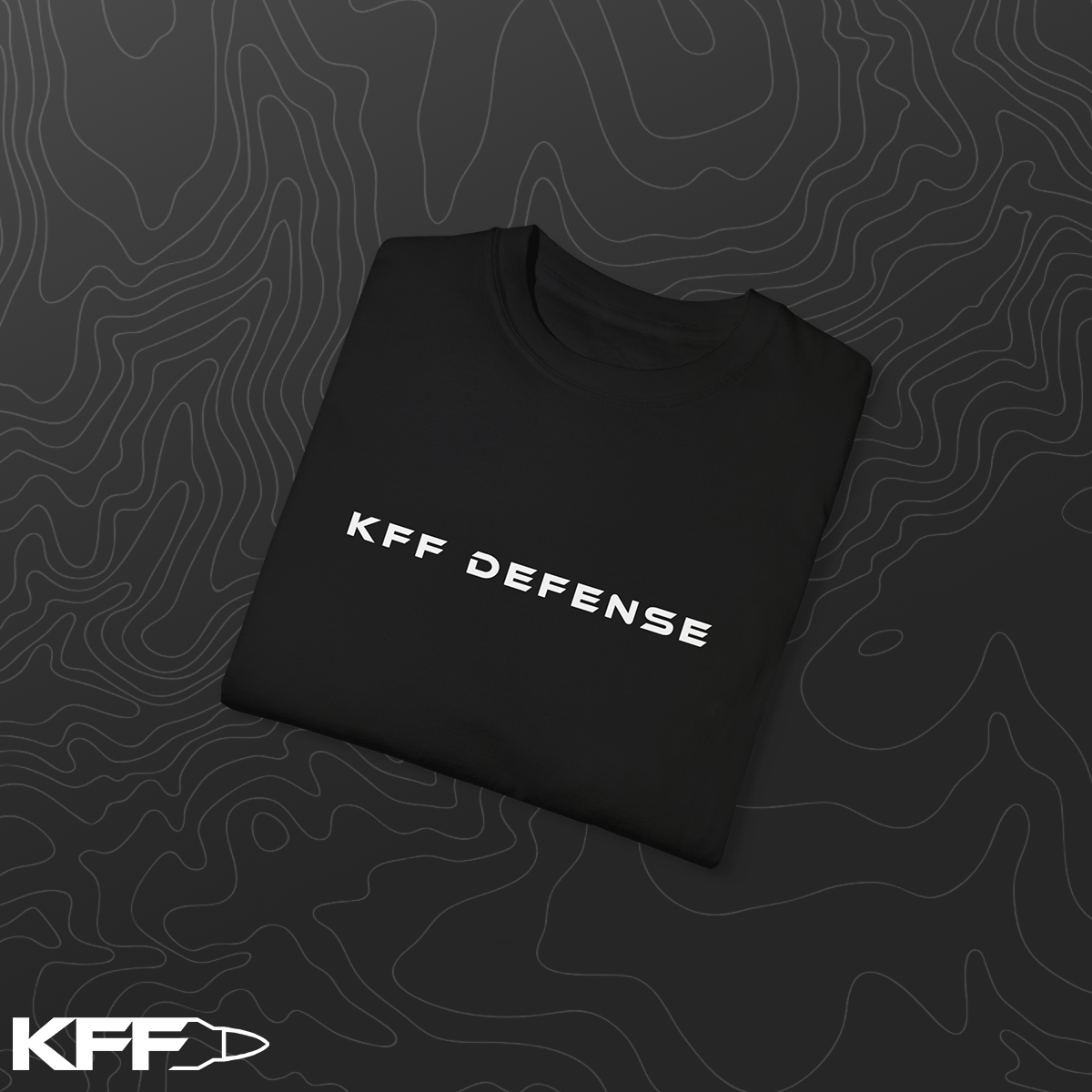 Folded black t-shirt with 'KFF Defense' text on a dark background
